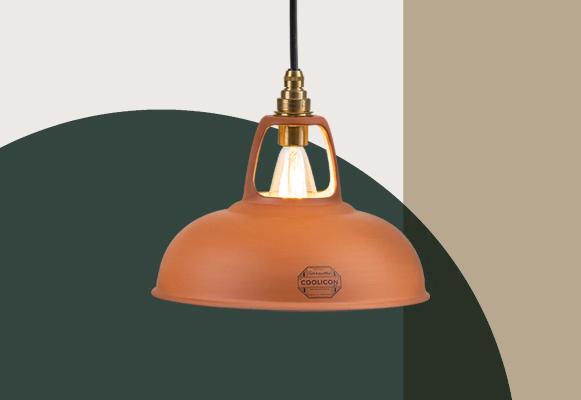 A Natural Terracotta shade  hanging over a colourful geometric background