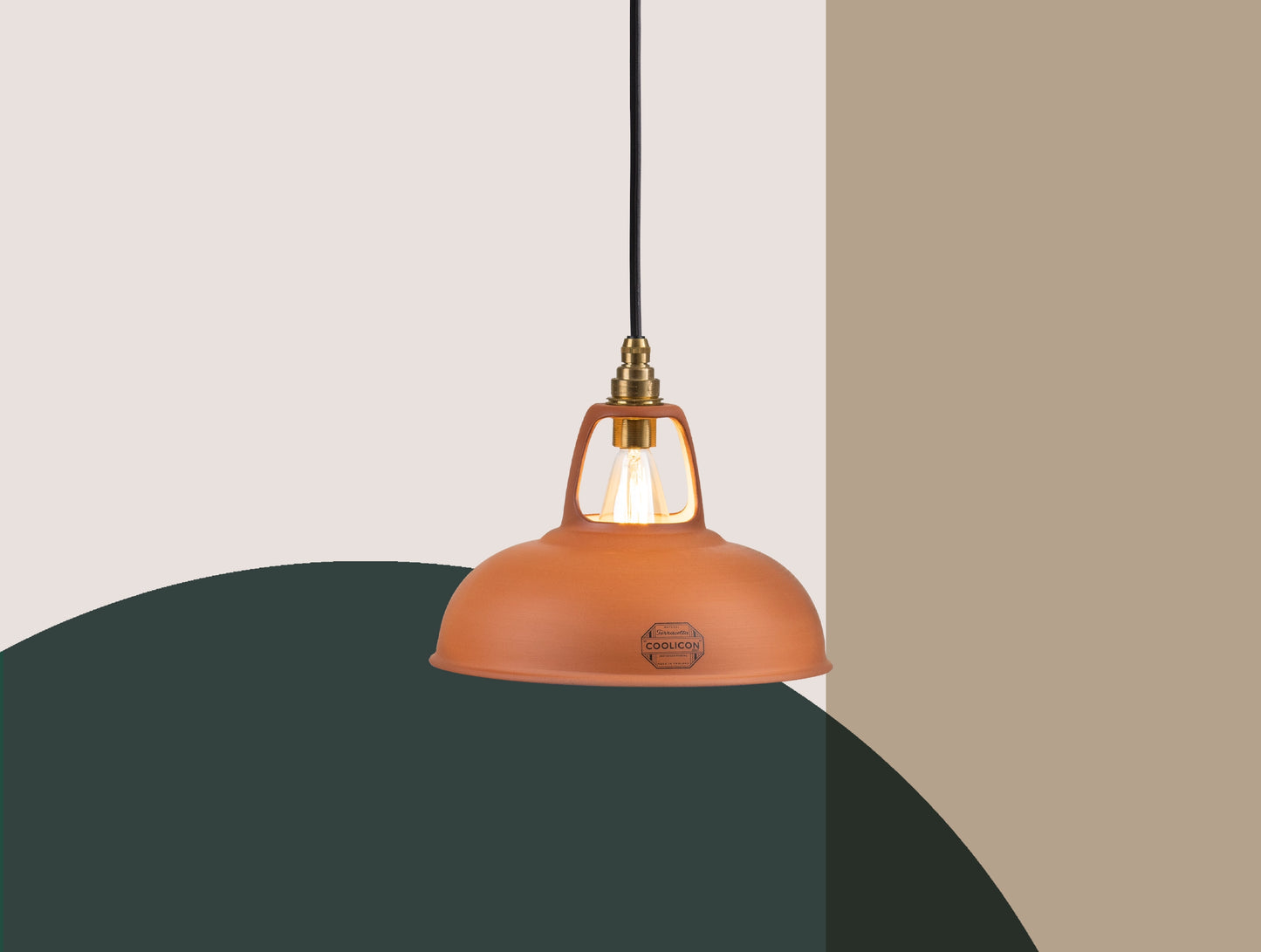 A Natural Terracotta shade hanging over a colourful geometric background
