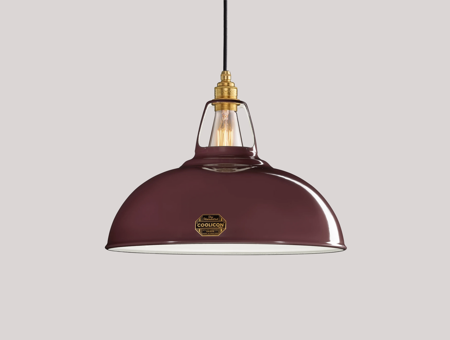 Large Metropolitan purple Coolicon lampshade with a Signature Brass pendant set over a light purple background