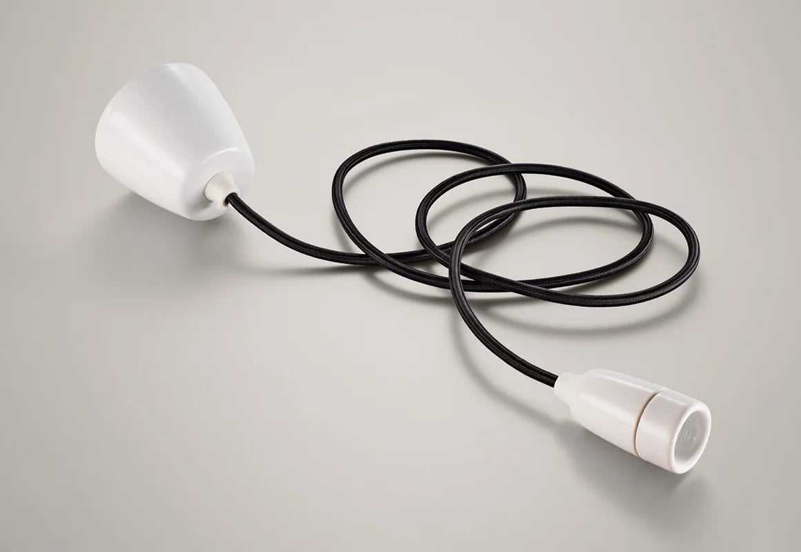 A Coolicon Porcelain pendant set with a white Vitreous Enamel ceiling cup and black cable