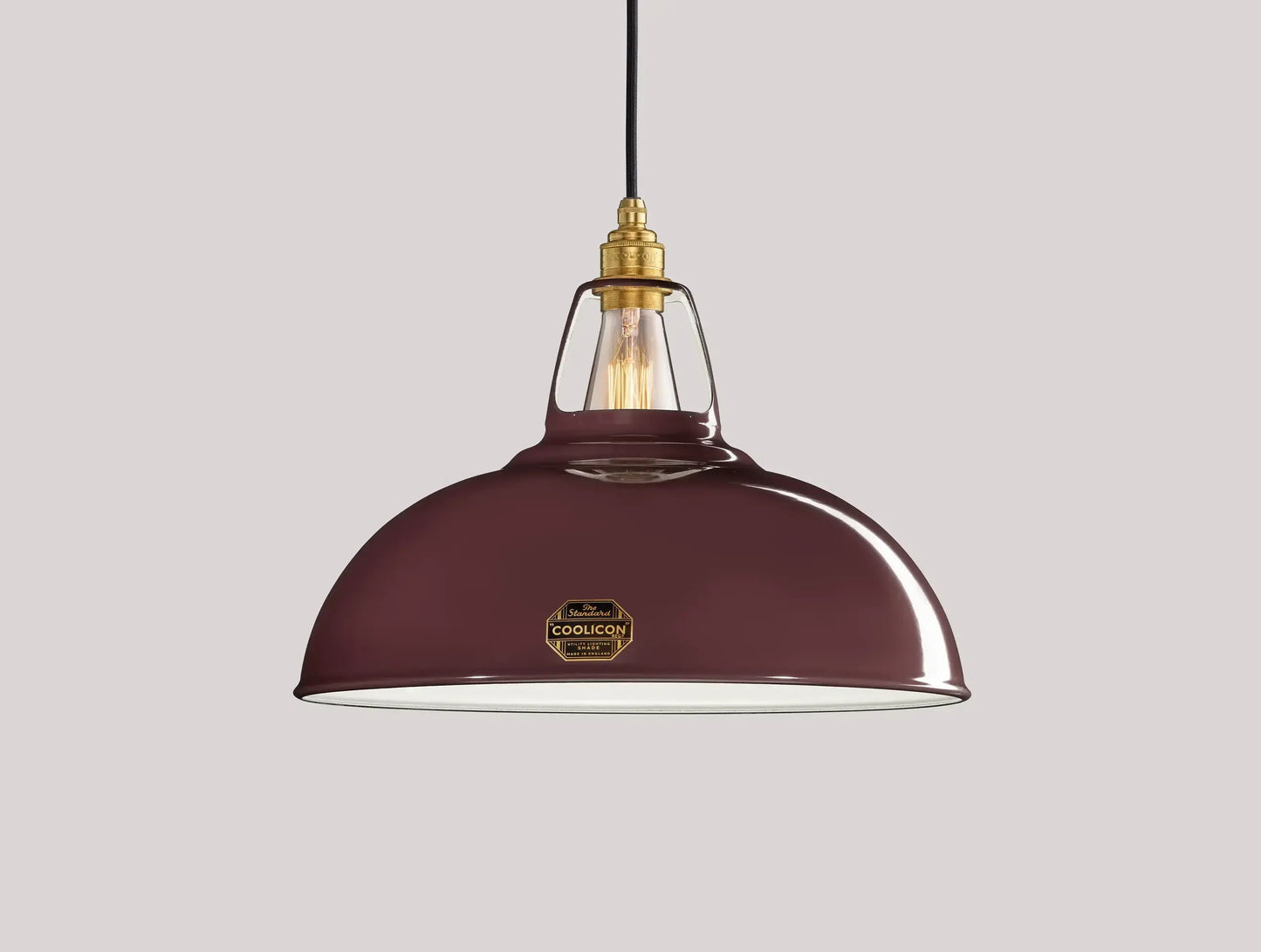 Large Metropolitan purple Coolicon lampshade with a Signature Brass pendant set over a light purple background
