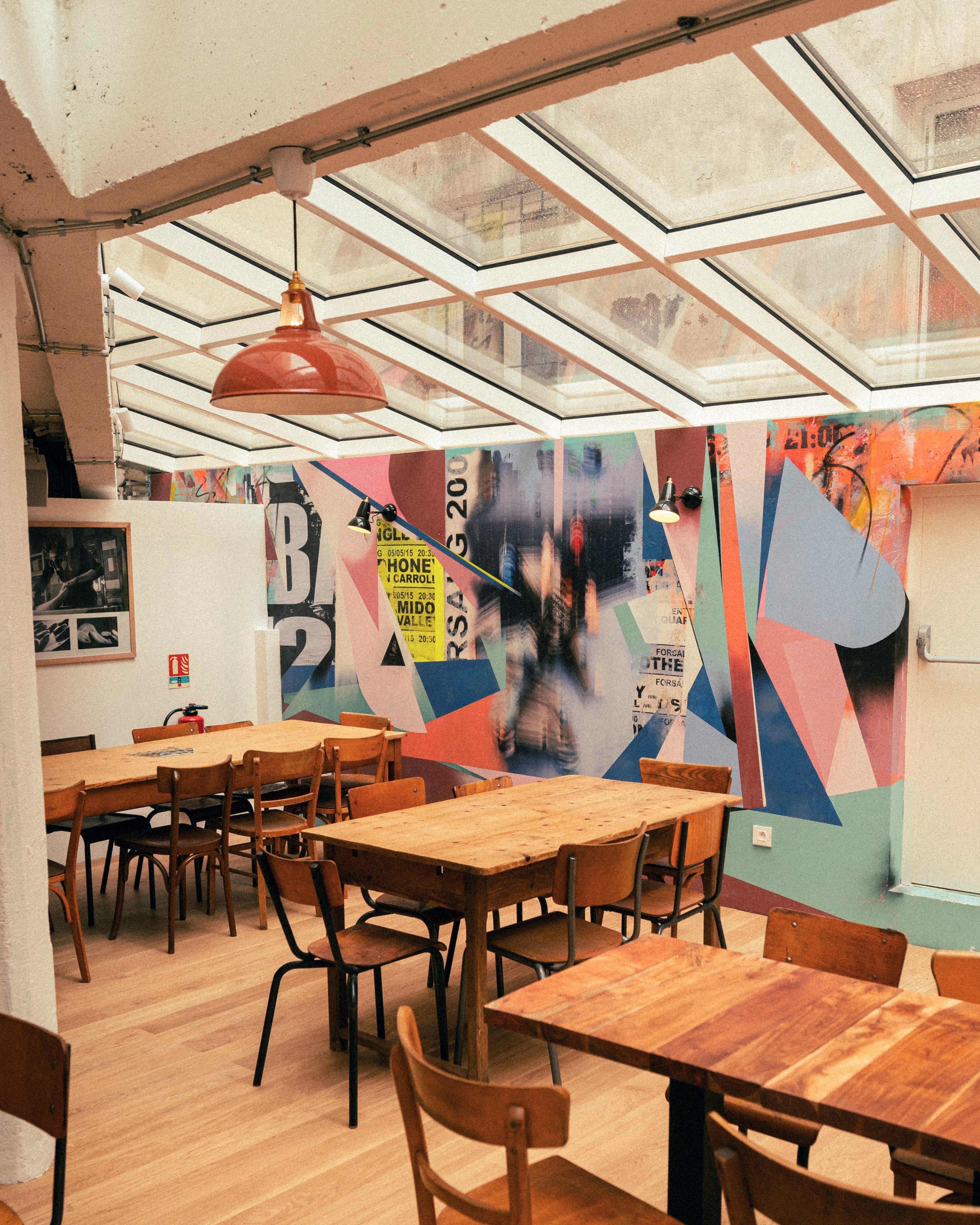 Large Terracotta pendant lampshade lighting a commercial cafe space in arkose's commercial bouldering lofts.