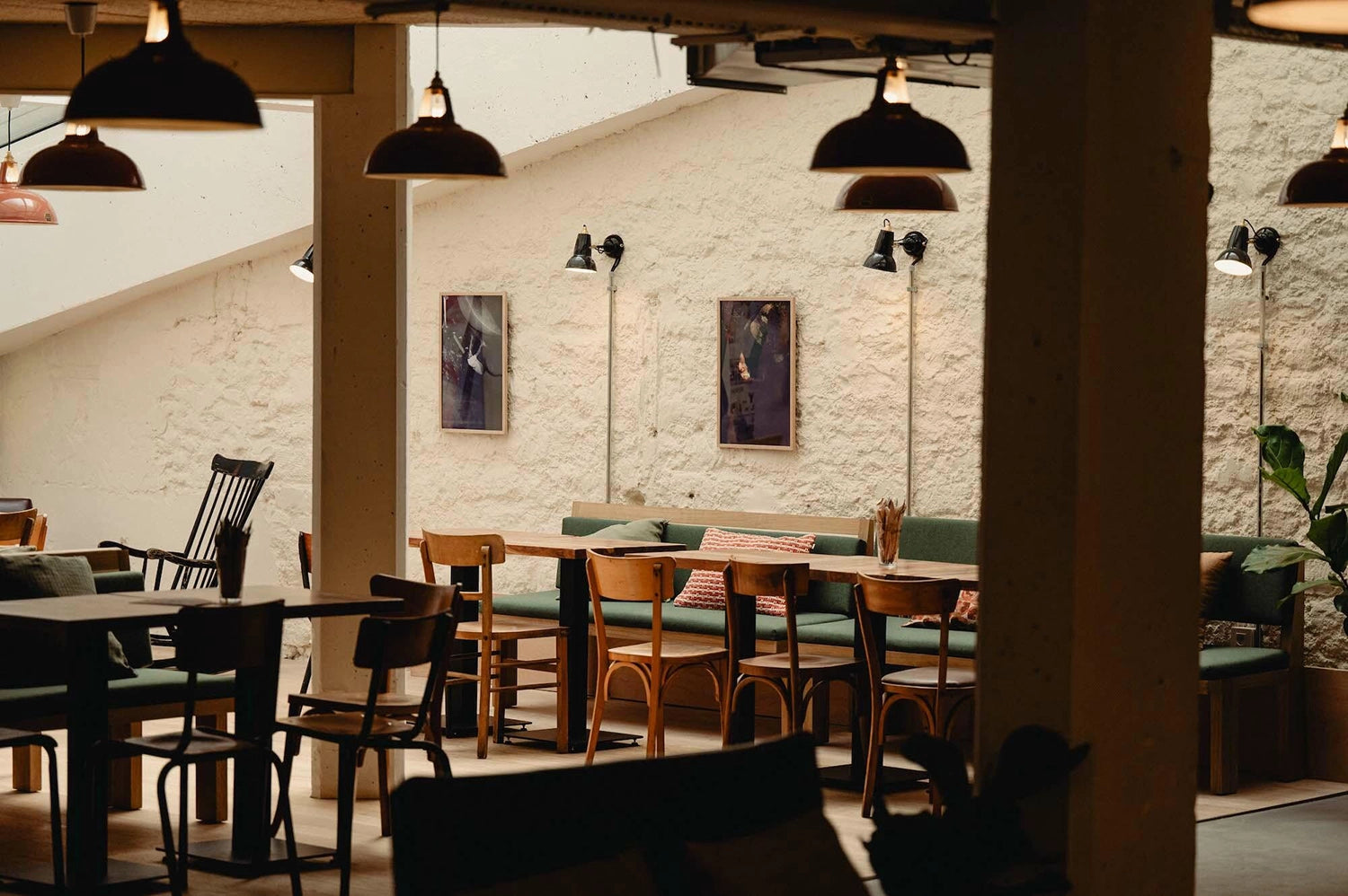 Wide shot of Large Terracotta Coolicon Lampshades hanging above Arkoses Commercial Cafe seating area