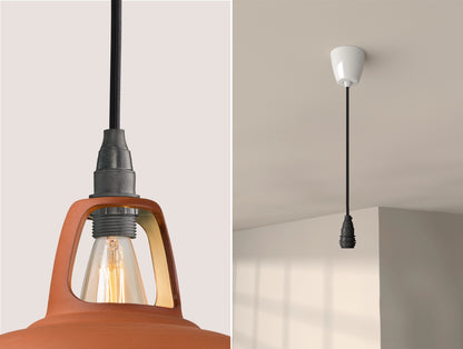 Close up of an E14 Industrial suspension set on a Natural Terracotta lampshade on the left. On the right, an E14 Industrial pendant set is hanging from the ceiling