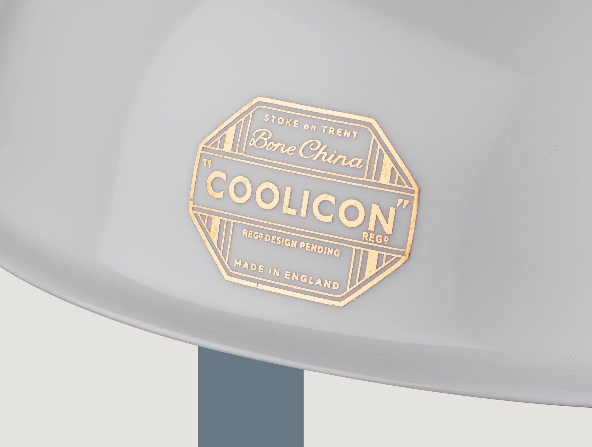 A close up of the 24 karats gold badge fired on the Coolicon Silhouette shade 