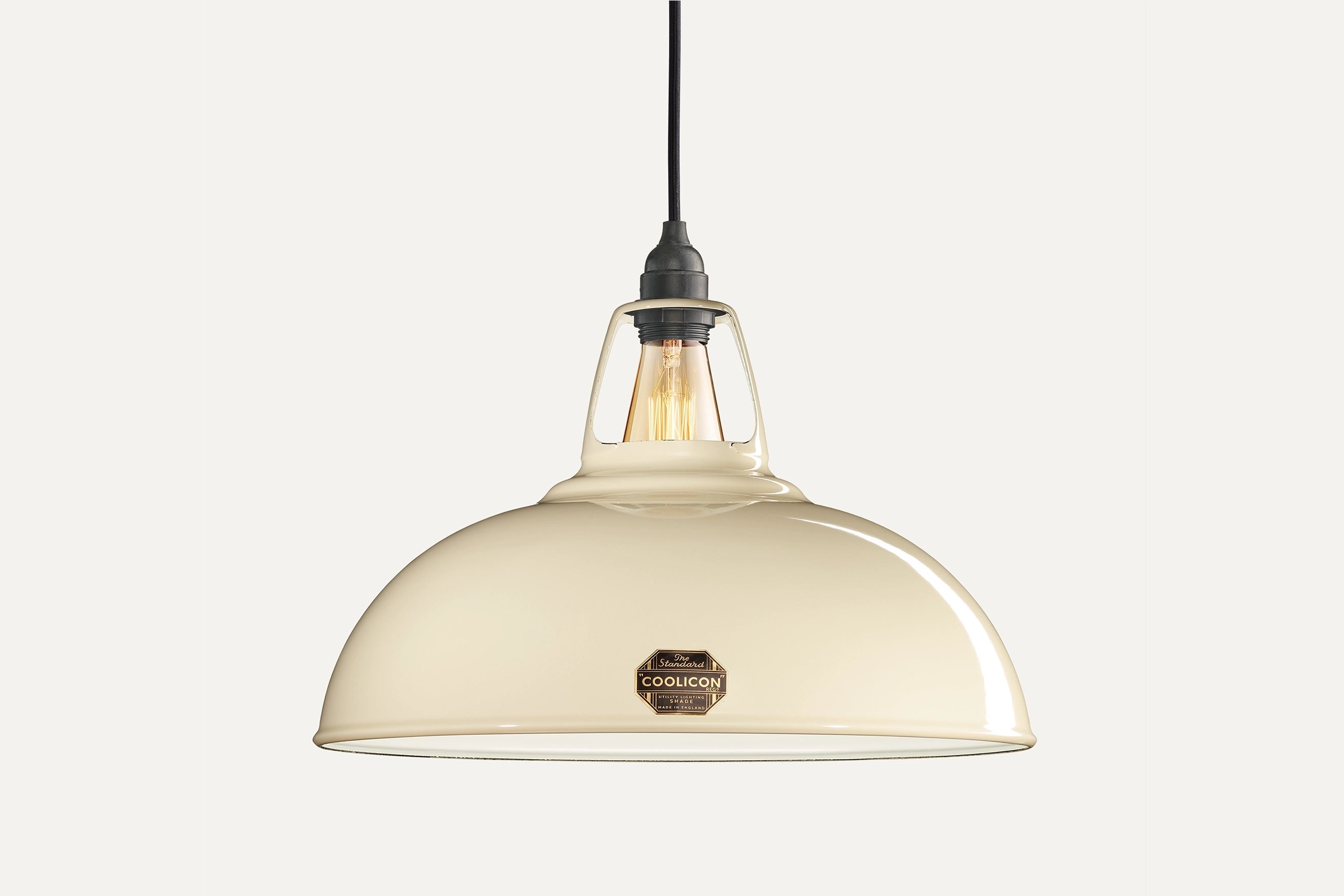 Large Classic Cream Coolicon lampshade with a black Industrial pendant set over a light cream background