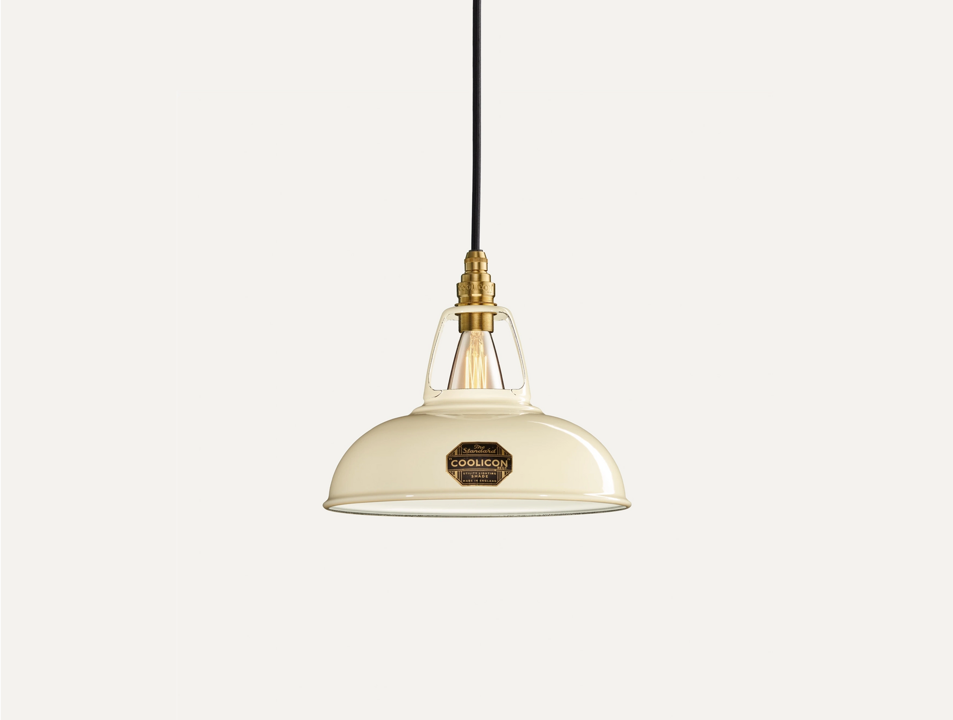 Classic Cream Coolicon lampshade with a black Industrial pendant set over a light cream background