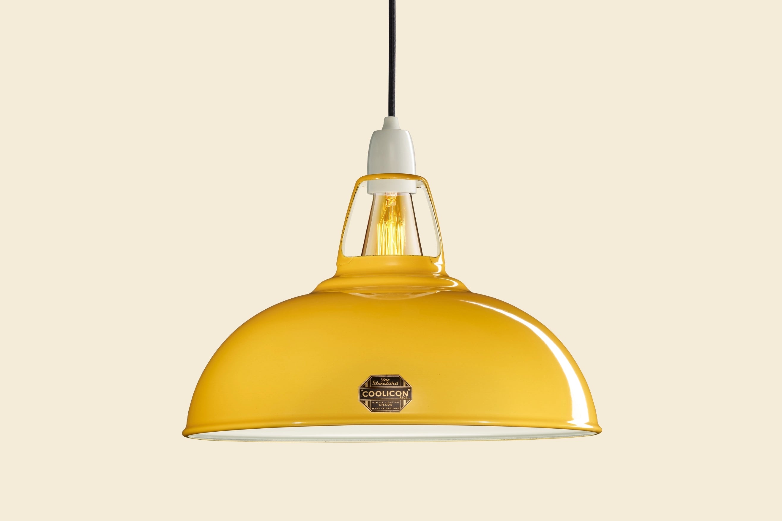 Large Deep Yellow Coolicon lampshade with a Porcelain pendant set over a yellow background