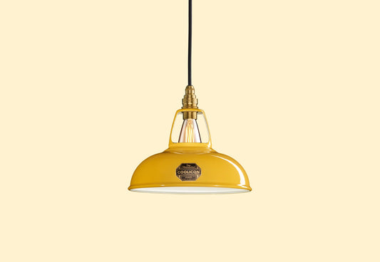 Deep Yellow Coolicon lampshade with a Brass pendant set over a yellow background