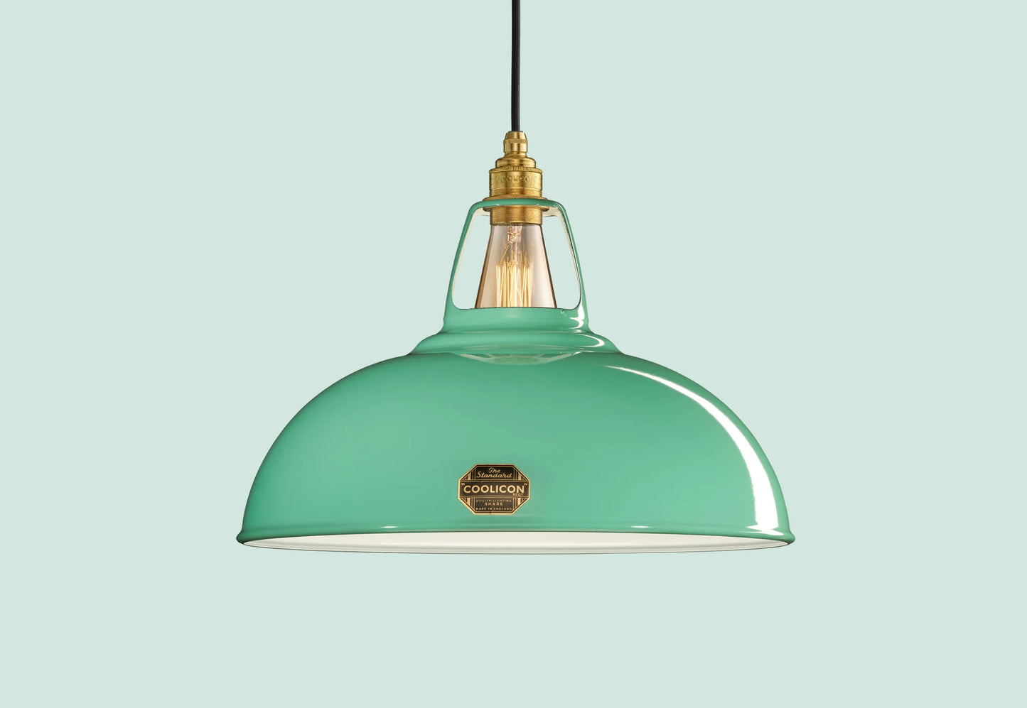 Large Fresh Teal Coolicon lampshade with a Brass pendant set over a light teal background