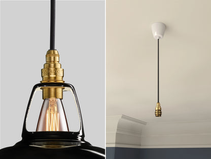Close up of an E14 Brass suspension set on a Jet Black shade on the left. On the right, an E14 Brass pendant set is hanging from the ceiling 