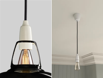 Close up of an E14 Porcelain suspension set on a Jet Black lampshade on the left. On the right, an E14 Porcelain pendant set with a lightbulb is hanging from the ceiling