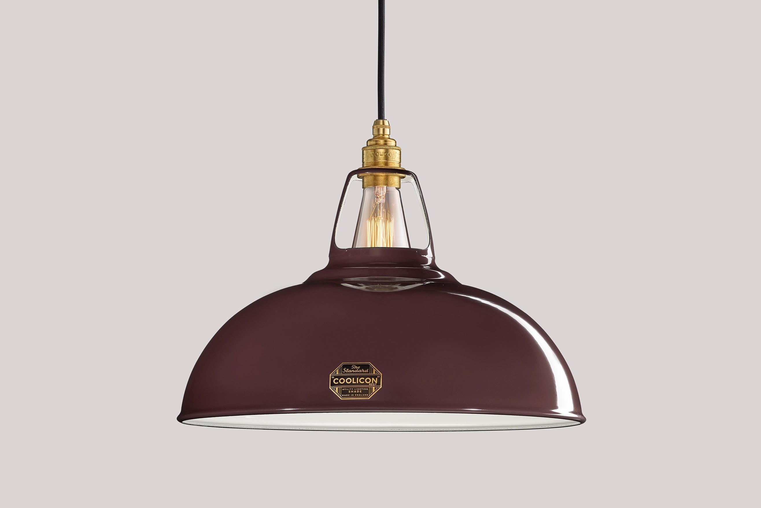 Large Metropolitan purple Coolicon lampshade with a Signature Brass pendant set over a light purple background