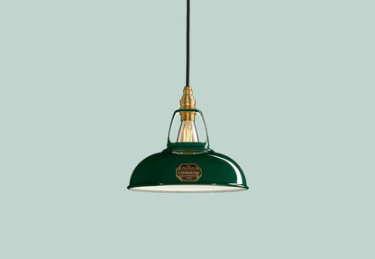 Green Coolicon lampshade with a Brass pendant set over a light green background