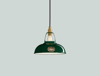 Green Coolicon lampshade with a Brass pendant set over a light green background