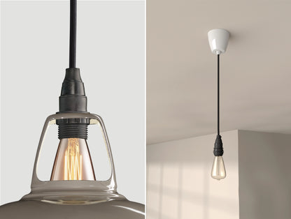 Close up of an E14 Industrial suspension set on an Original Grey lampshade on the left. On the right, an E14 Industrial pendant set with a lightbulb is hanging from the ceiling