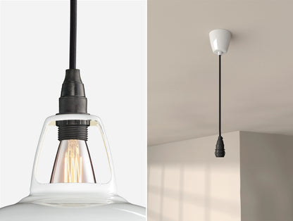 Close up of an E14 Industrial suspension set on a Original White lampshade on the left. On the right, an E14 Industrial pendant set is hanging from the ceiling