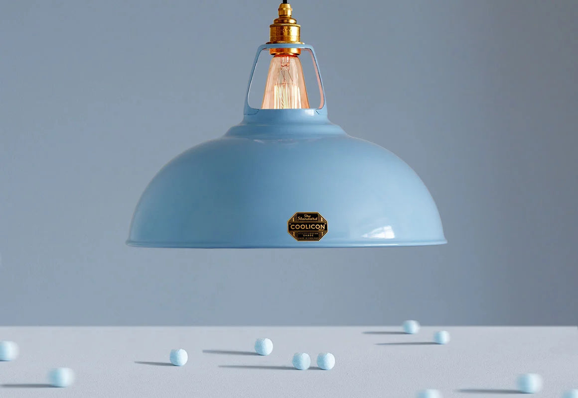 Large Sky Blue Coolicon lampshade hanging over a table with blue sweets