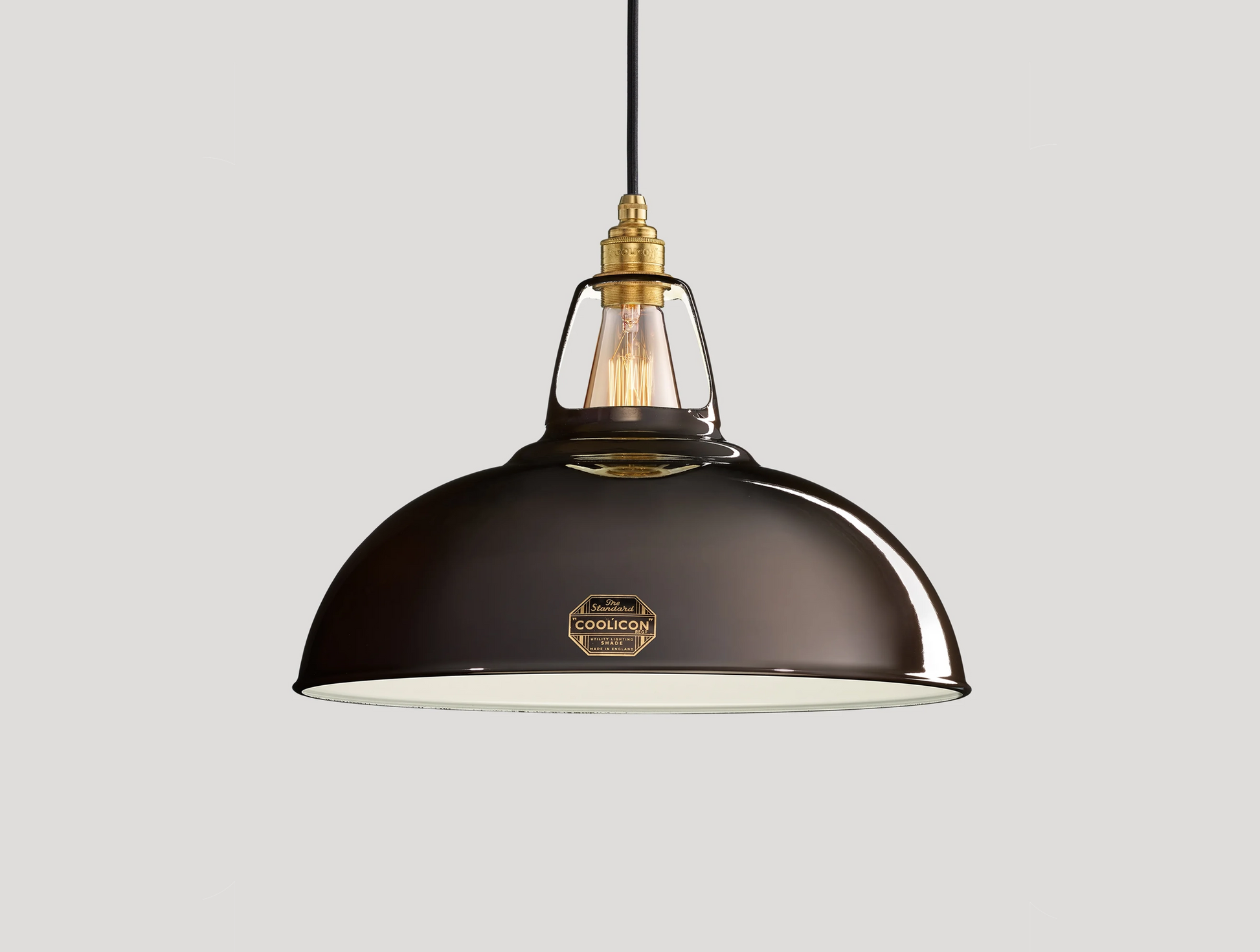 Large Pewter Coolicon lampshade with a Signature Brass pendant set over a light grey background