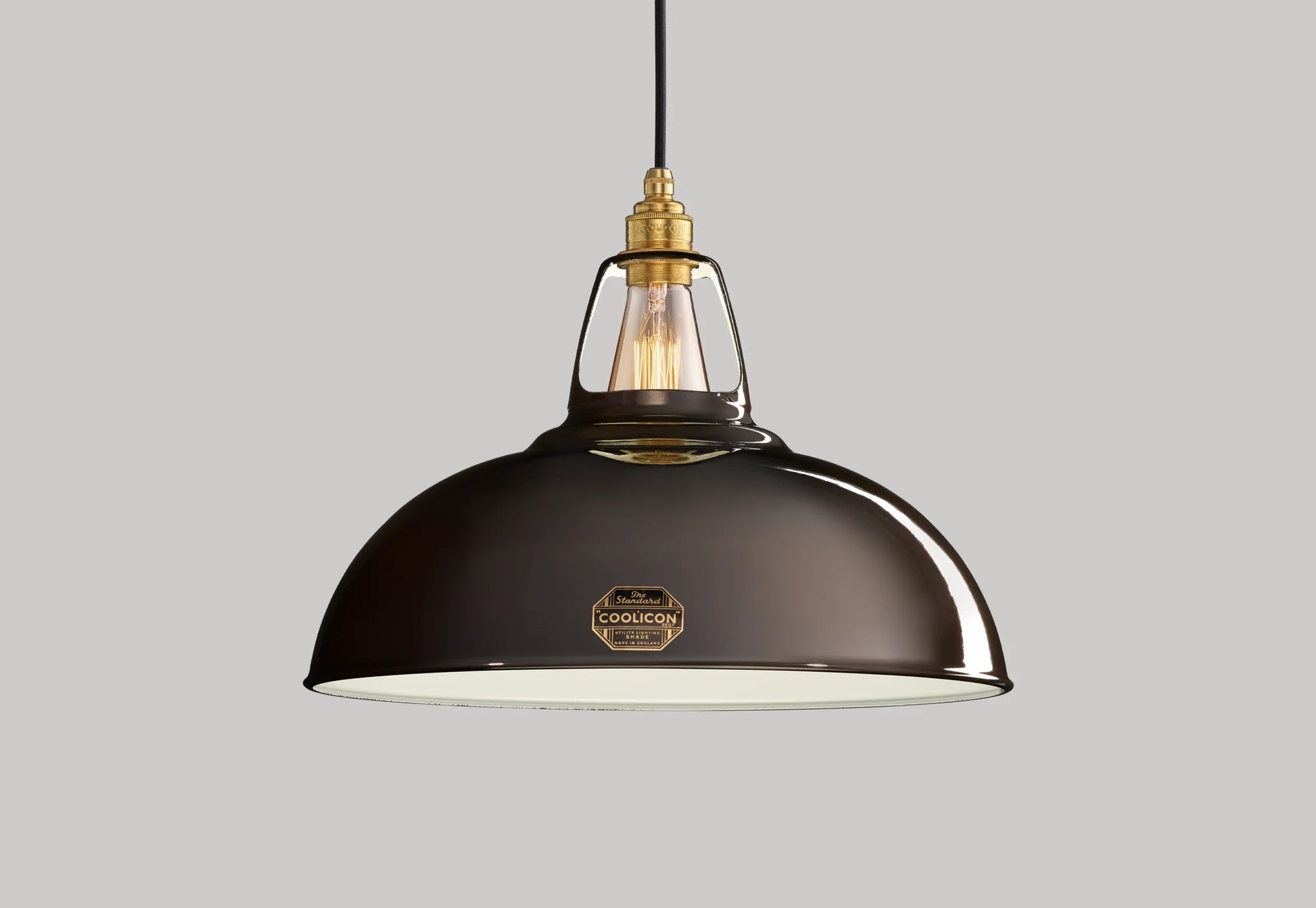 Large Pewter Coolicon lampshade with a Signature Brass pendant set over a light grey background