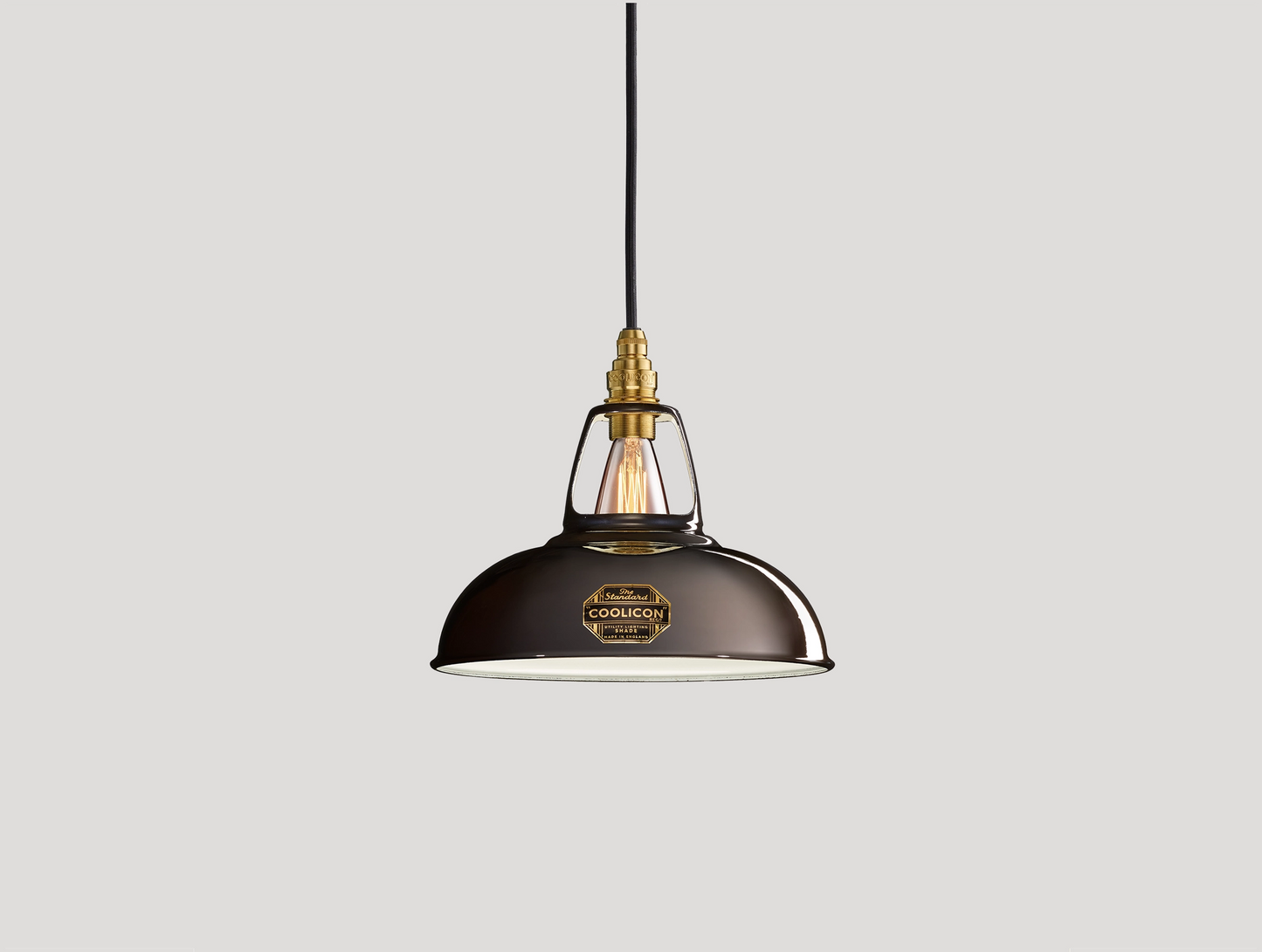 Pewter Coolicon lampshade with a Signature Brass pendant set over a light grey background