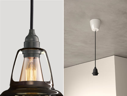 Close up of an E27 Industrial suspension set on a Pewter lampshade on the left. On the right, an E27 Industrial pendant set is hanging from the ceiling