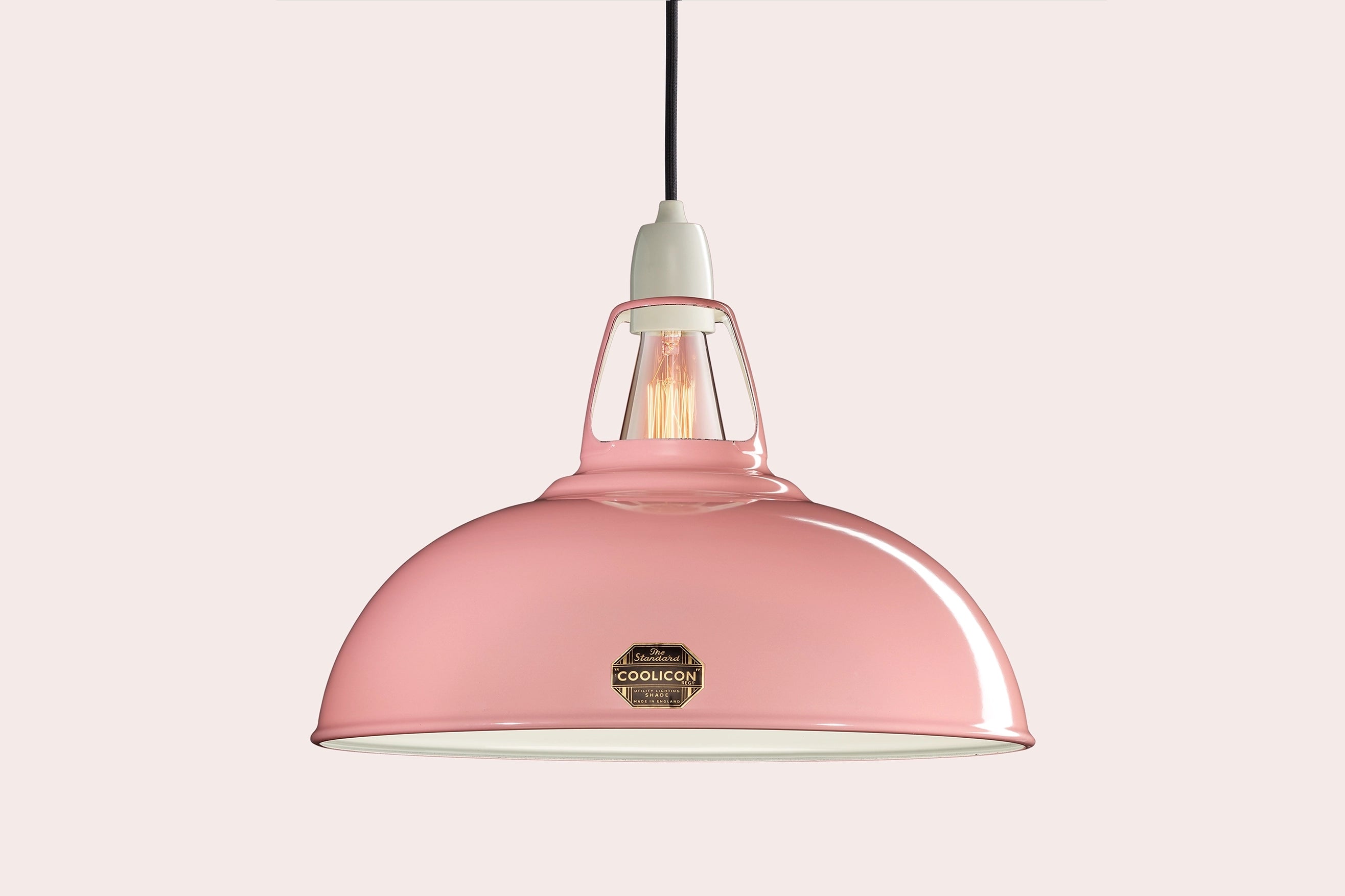 Large Powder Pink Coolicon lampshade with a Porcelain pendant set over a light pink background