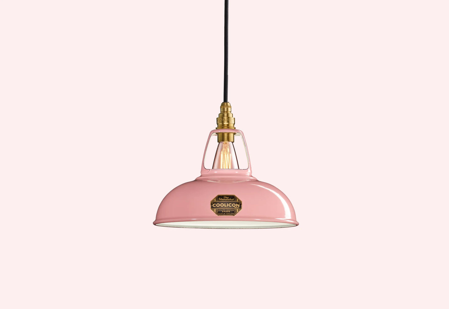 Powder Pink Coolicon lampshade with a Brass pendant set over a light pink background