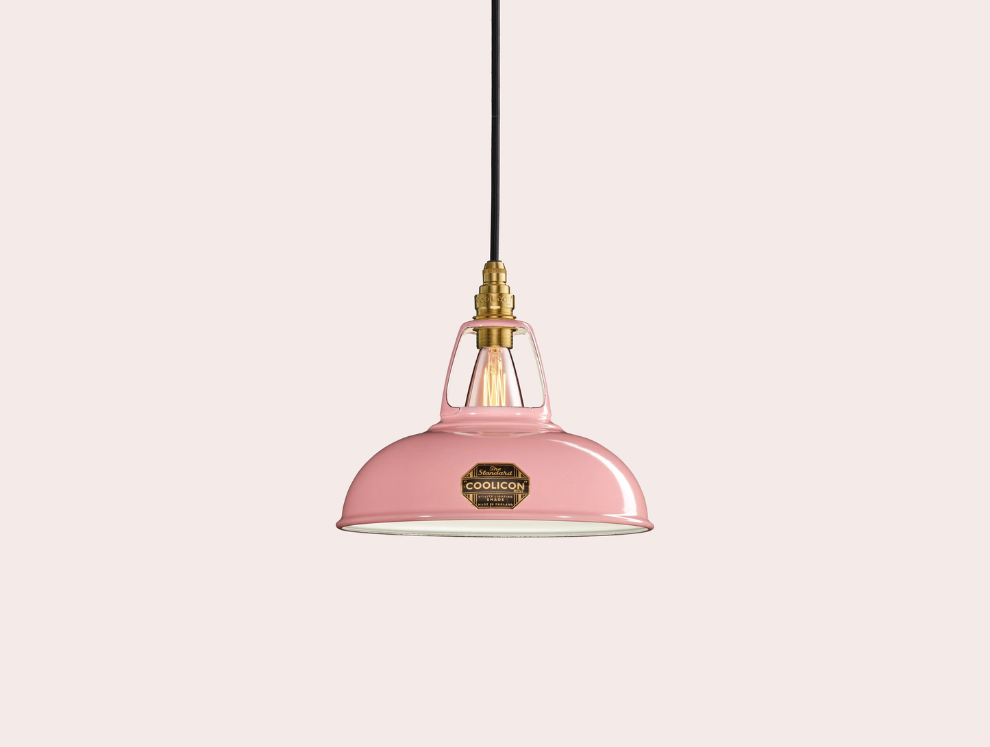 Powder Pink Coolicon lampshade with a Brass pendant set over a light pink background