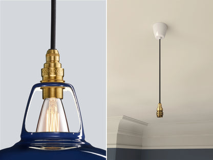 Close up of an E14 Brass suspension set on a Piccadilly Line Blue lampshade on the left. On the right, an E14 Industrial pendant set is hanging from the ceiling