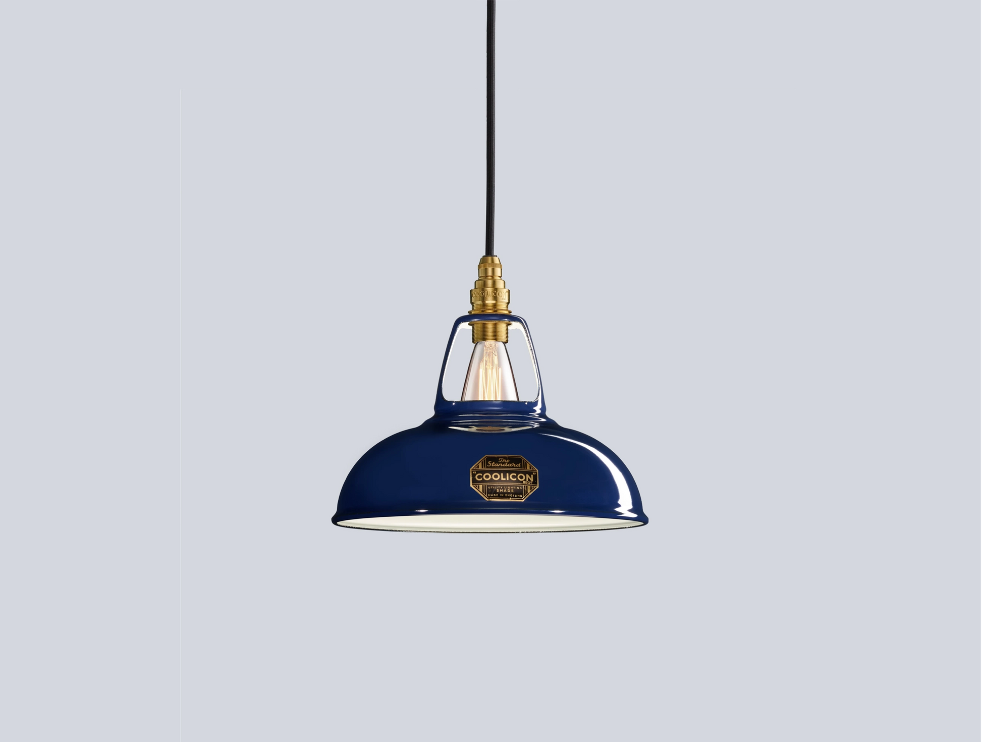 An Original Royal Blue shade hanging over a blue background