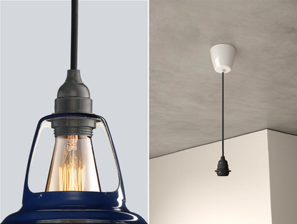 Close up of an E27 Industrial suspension set on a Piccadilly Line Blue lampshade on the left. On the right, an E27 Industrial pendant set is hanging from the ceiling