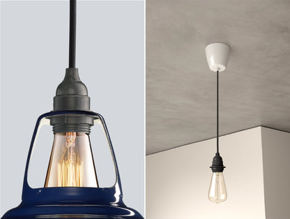 Close up of an E27 Industrial suspension set on a Piccadilly Line Blue lampshade on the left. On the right, an E27 Industrial pendant set with a lightbulb is hanging from the ceiling