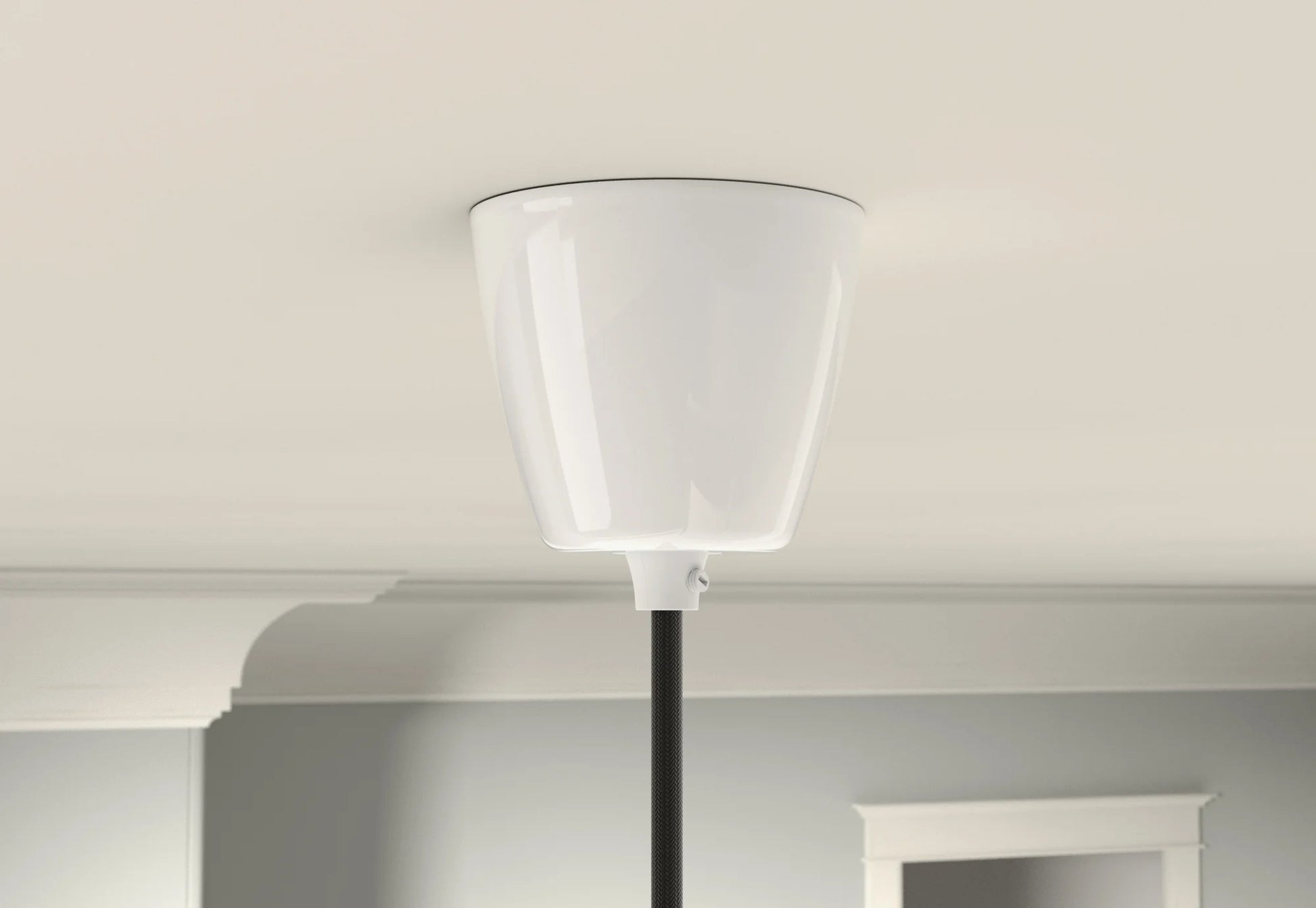 A white Coolicon Vitreous Enamel ceiling cup on a light cream ceiling