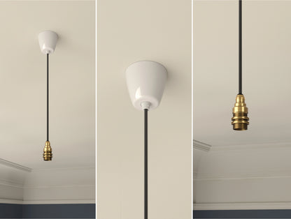 An E14 Brass Coolicon pendant set with a Vitreous Enamel ceiling cup hanging from a Georgian-style ceiling