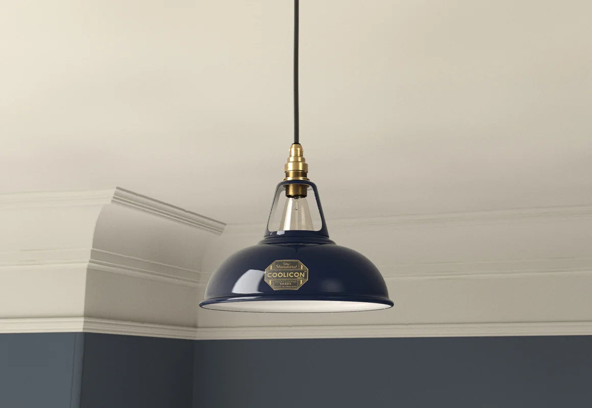 An Original Royal Blue lampshade with a Coolicon Signature Brass pendant set hanging from the ceiling