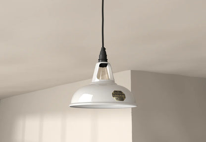 An Original White lampshade with a Coolicon Industrial pendant set hanging from the ceiling