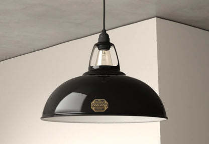 A Large Jet Black lampshade with a Coolicon Industrial pendant set hanging from the ceiling