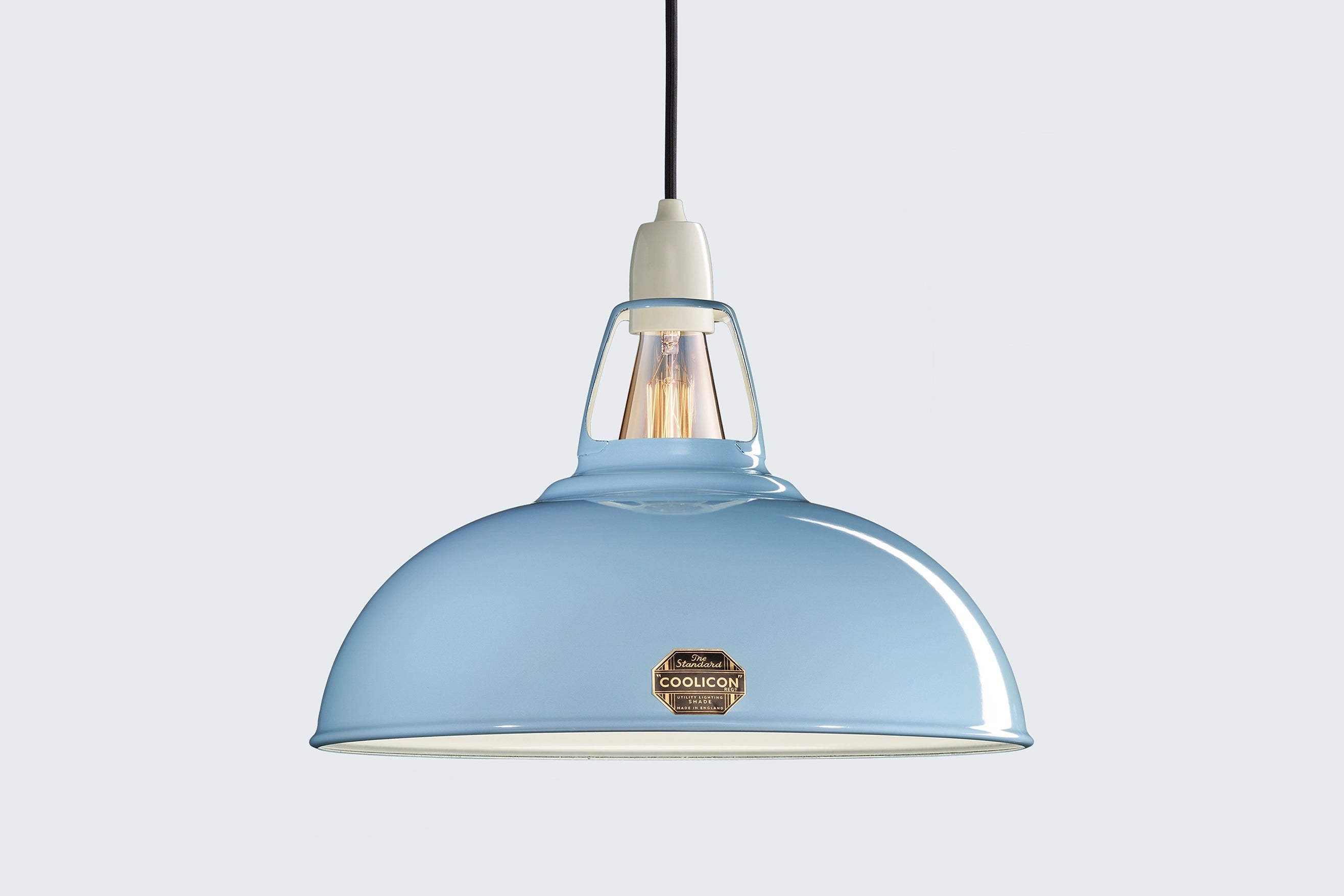 Large Sky Blue Coolicon lampshade with a Porcelain pendant set over a light blue background