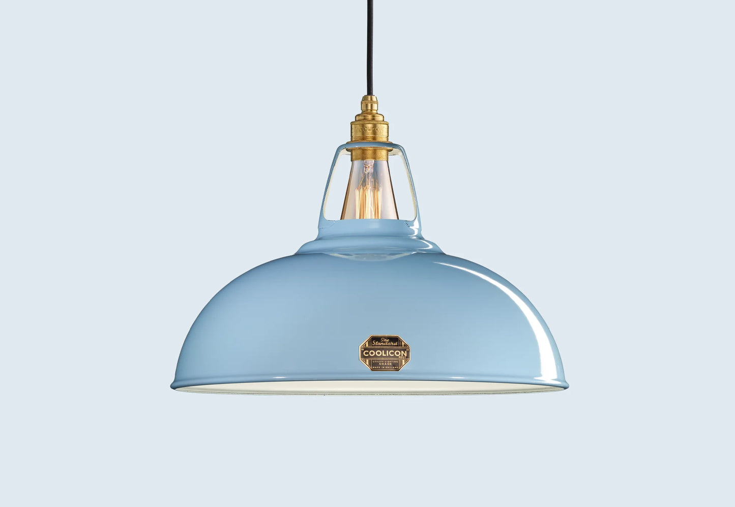 Large Sky Blue Coolicon lampshade with a Brass pendant set over a light blue background