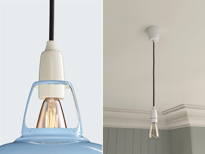 Close up of an E14 Signature Brass suspension set on a Sky Blue lampshade on the left. On the right, an E14 Brass pendant set with a lightbulb is hanging from the ceiling