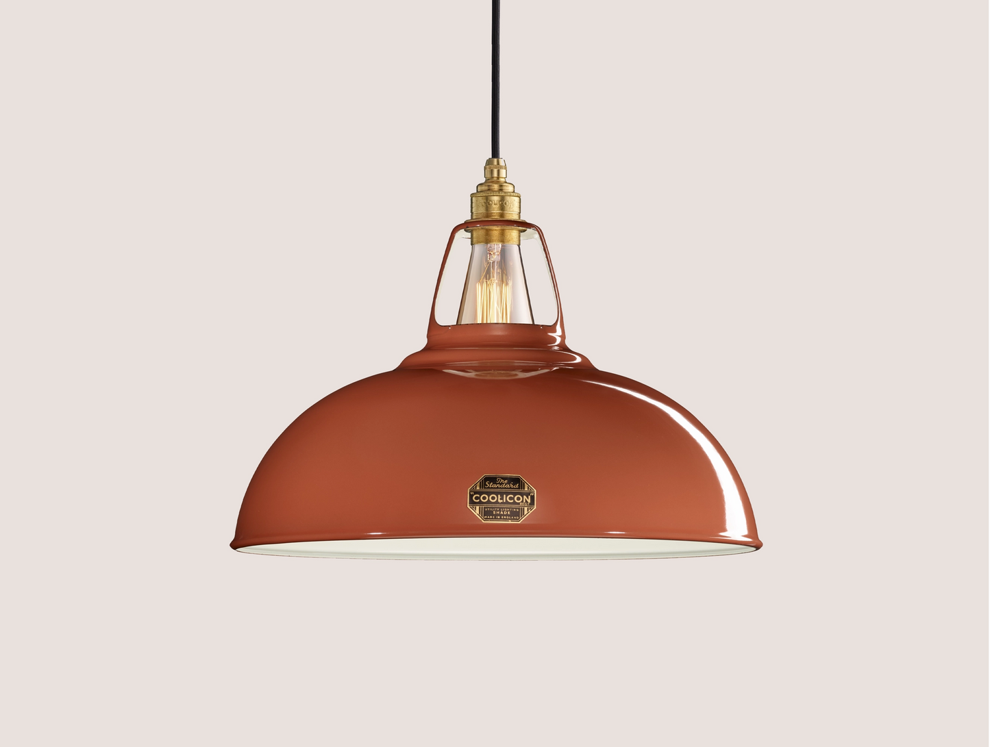 Large Terracotta Coolicon lampshade with a Porcelain pendant set over a light teal background