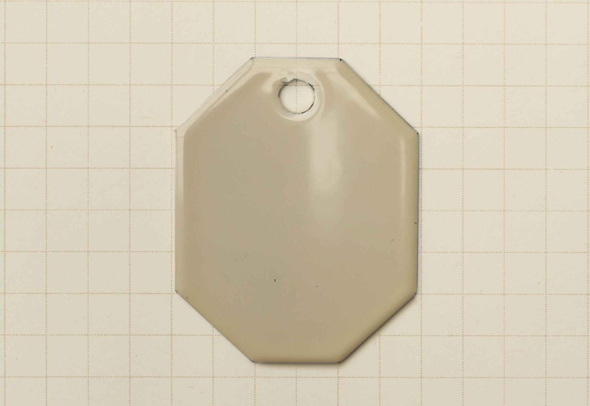 A vitreous enamel colour sample of the colour Classic Cream from Coolicon Lighting