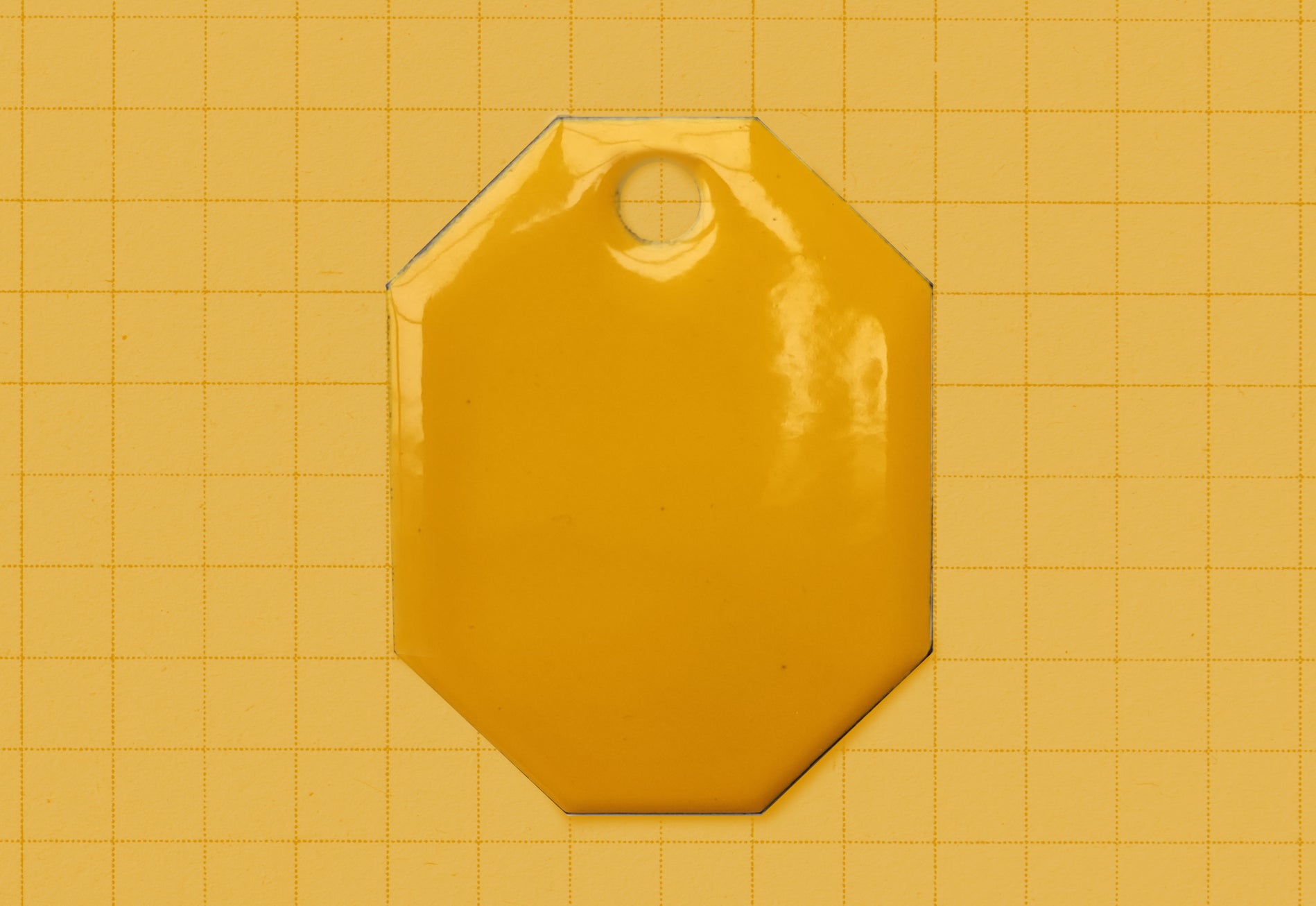 A vitreous enamel colour sample of the colour Deep Yellow from Coolicon Lighting