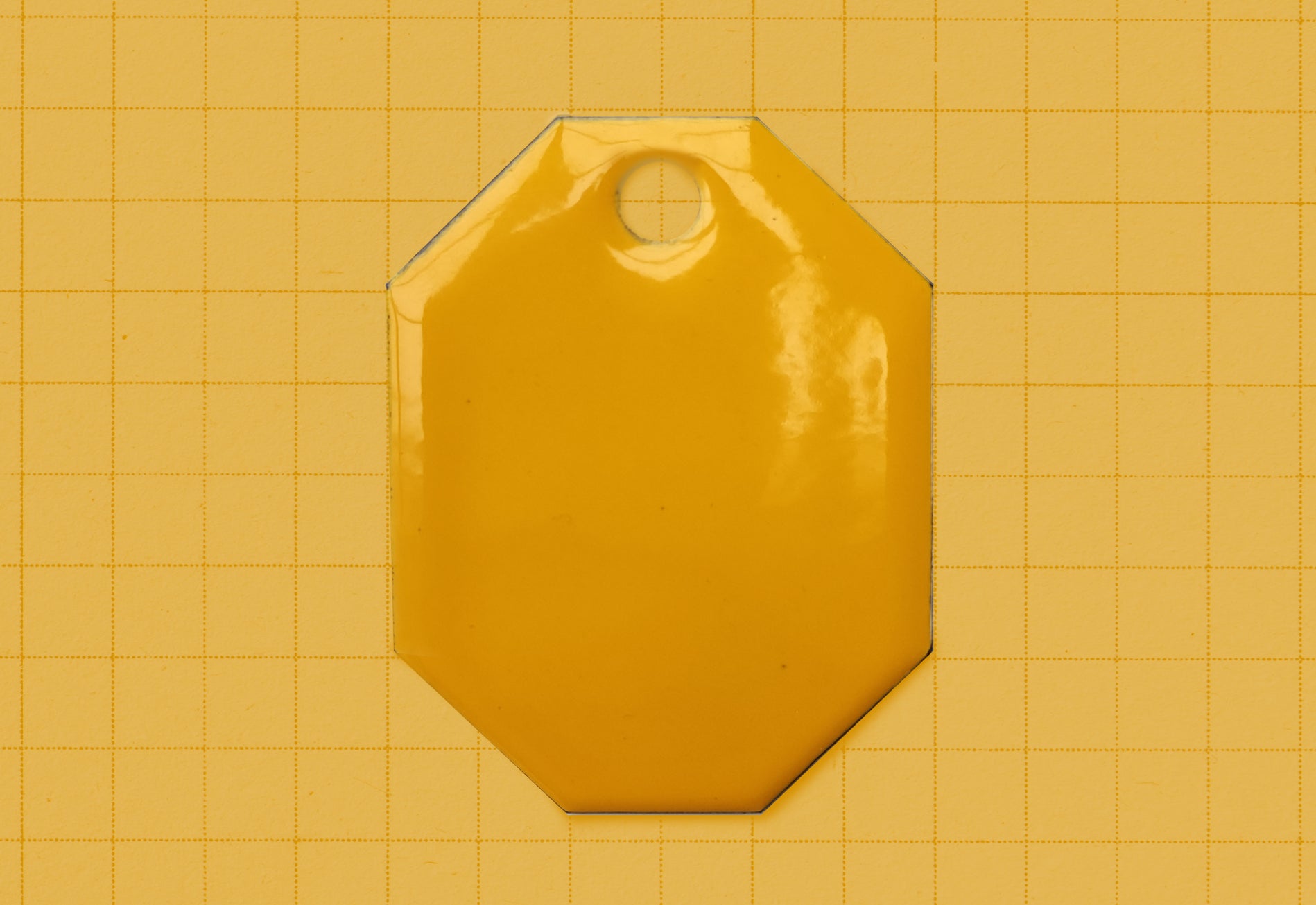 A vitreous enamel colour sample of the colour Deep Yellow from Coolicon Lighting