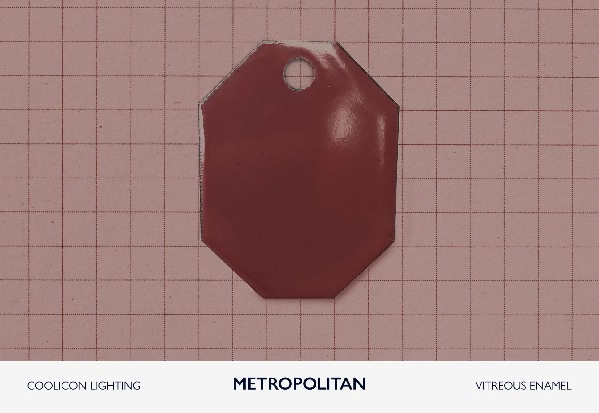 A vitreous enamel colour sample of the colour Metropolitan from Coolicon Lighting. This is a rich burgundy and maroon colour.