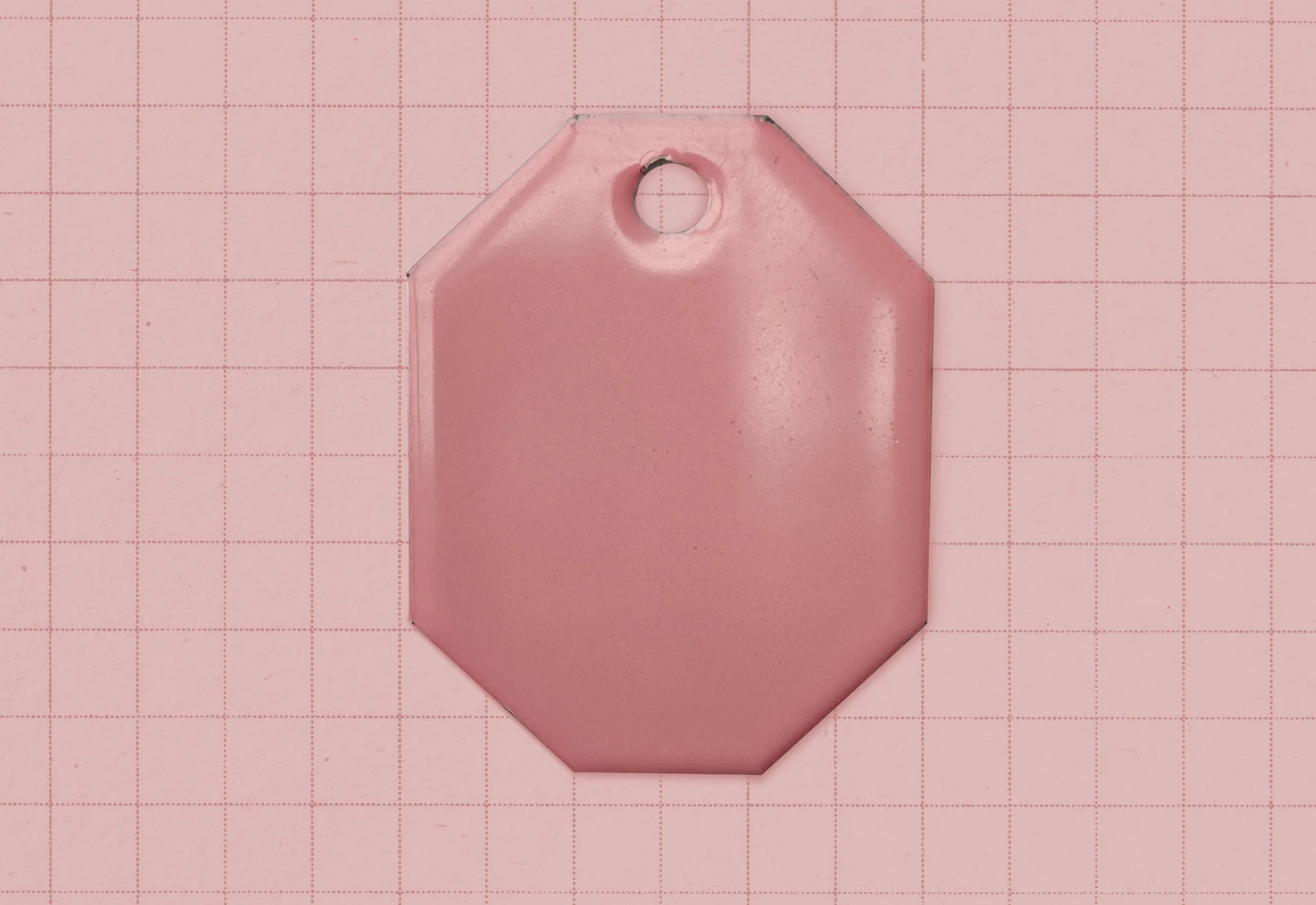 A vitreous enamel colour sample of the colour Powder Pink from Coolicon Lighting