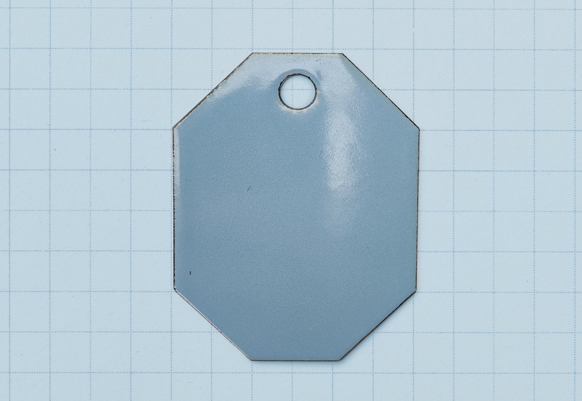A vitreous enamel colour sample of the colour Sky Blue from Coolicon Lighting
