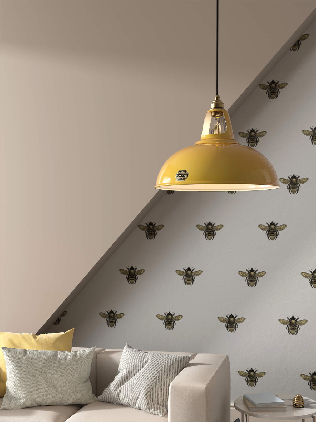 An Original and a Large Pink lampshade hang over a cream sofa, with pink glass panels in the background