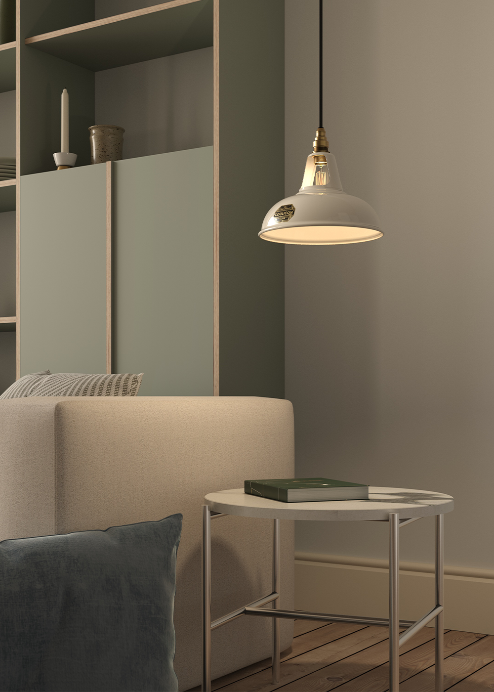 An Original and a Large Sky Blue lampshade hanging over an armchair, in front of a frosted glass panel